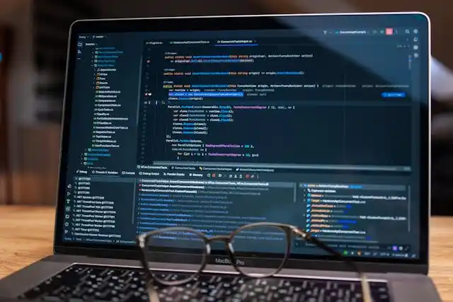 Software development code displayed on laptop screen for application engineering and programming
